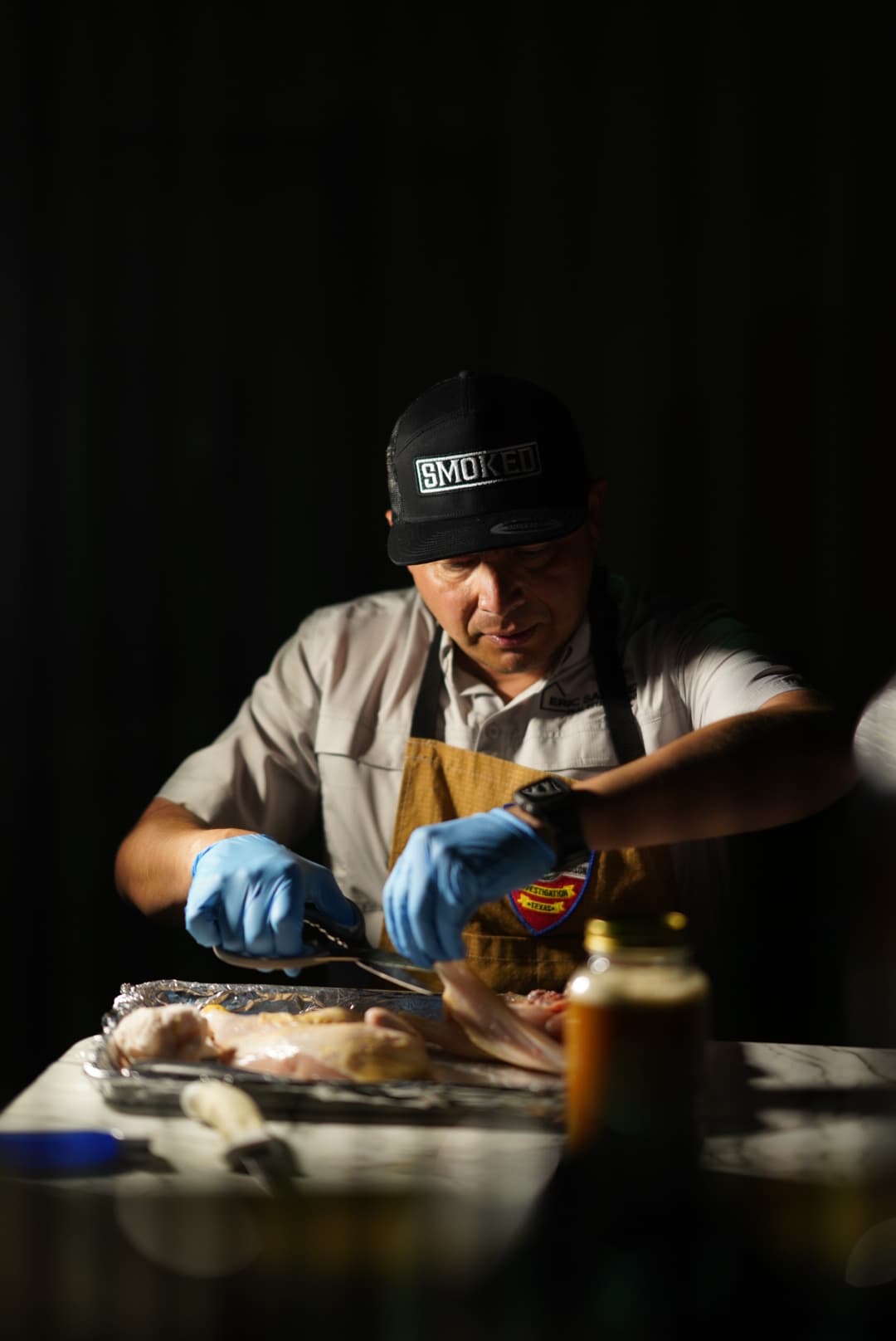 Smoked BBQ Apparel pitmaster in action